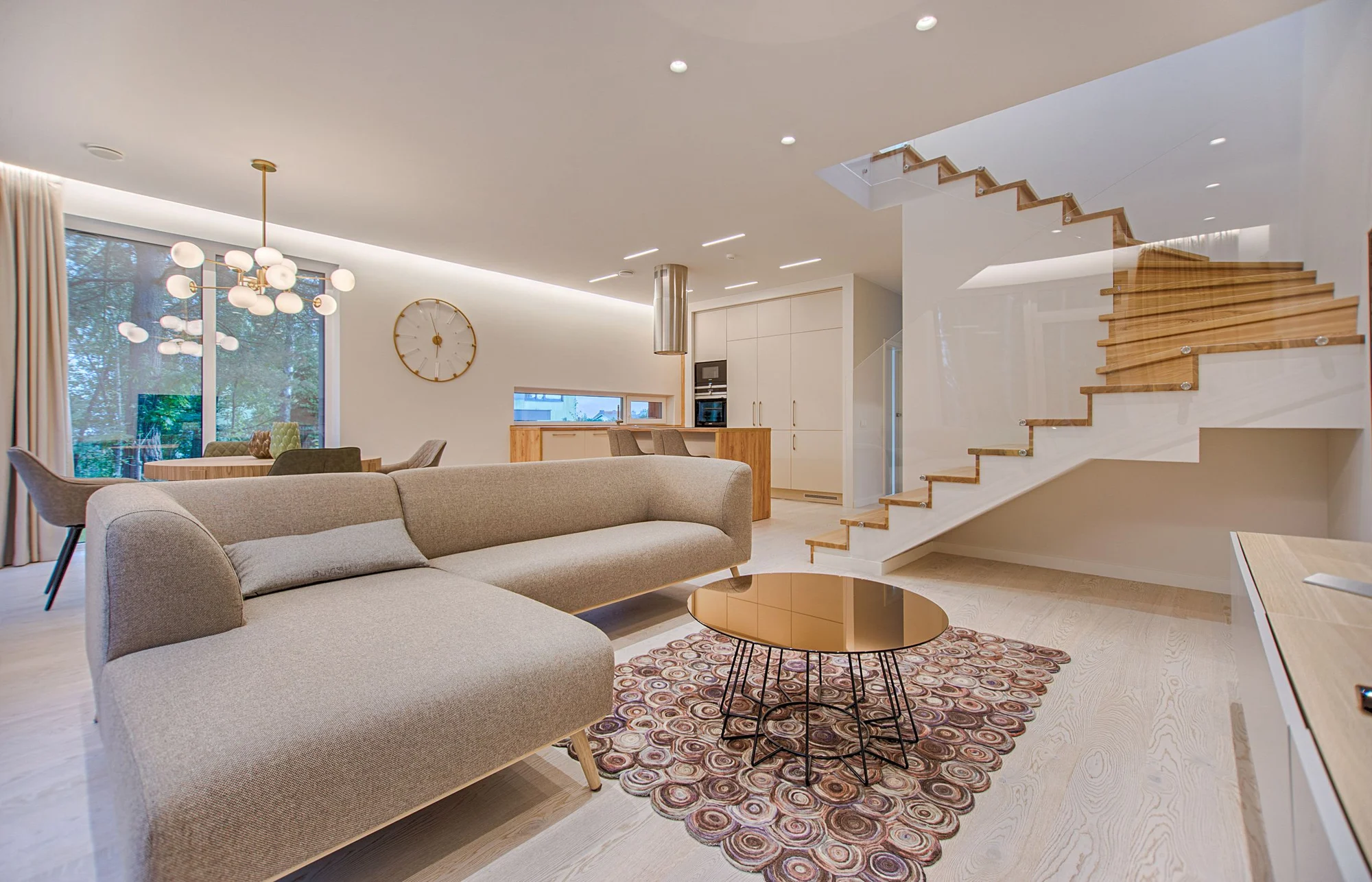 Bright living room with seating, indoor plants and natural light